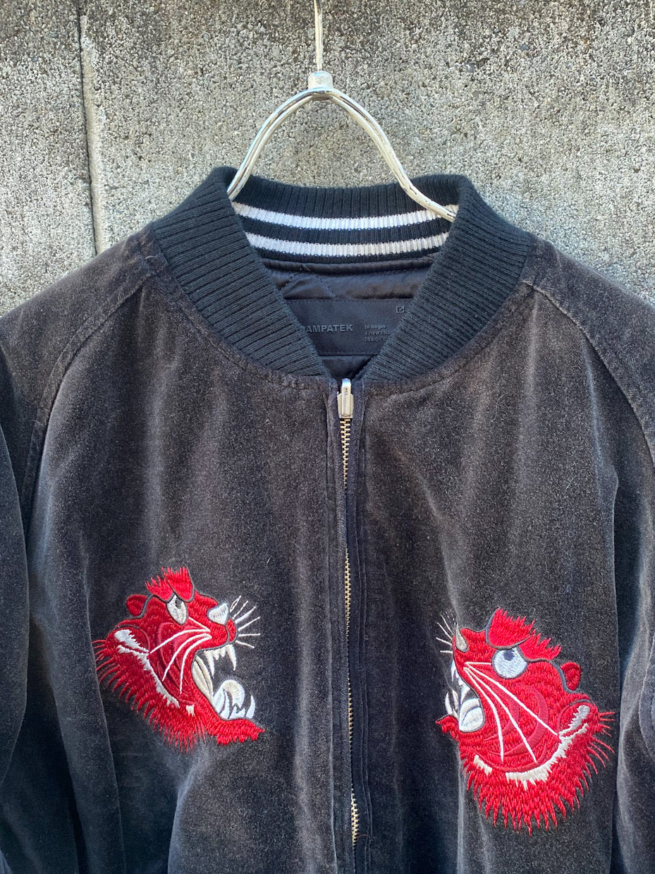 aging reversible souvenir jacket