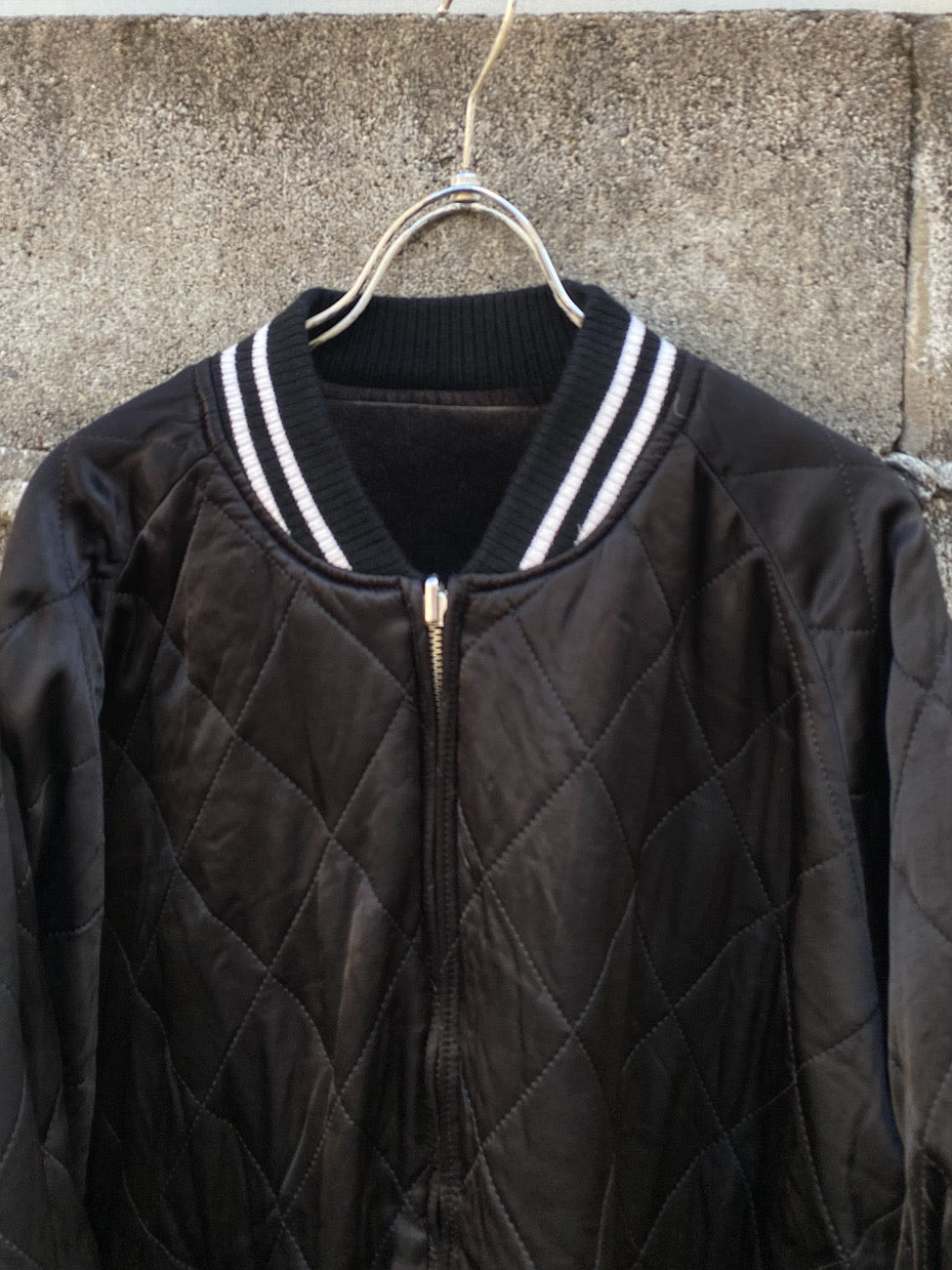 aging reversible souvenir jacket